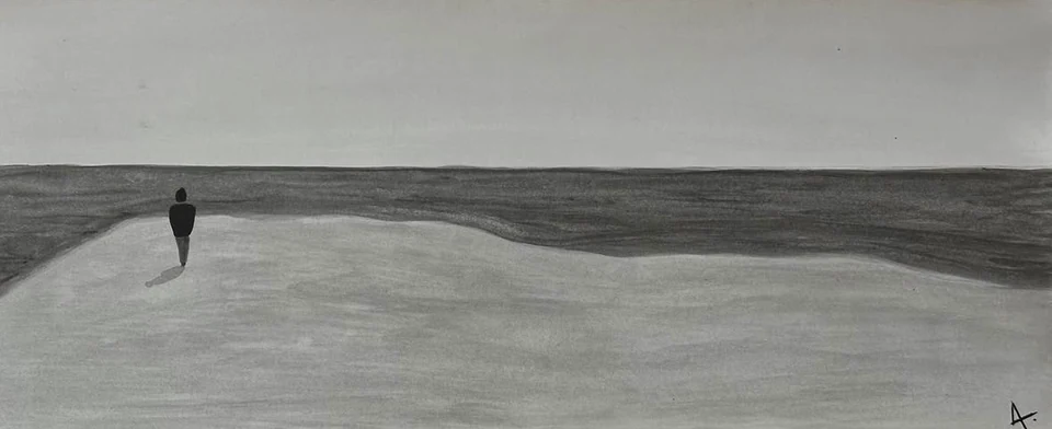 A solitary figure on a pale shoreline between a dark sea and grey sky.